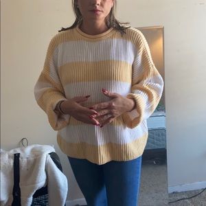 Yellow and white striped knitted sweater
